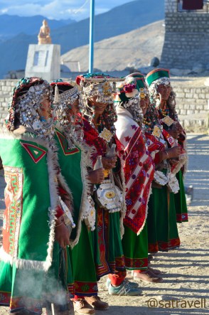All set to participate in marriage functions, family members outfitted in traditional attire lined up on the ground of Sacred Compound