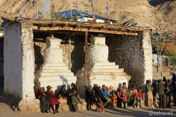 Villagers assembled alongside ancient Chortens, part of the tenth-century Sacred Compound, to watch the proceedings