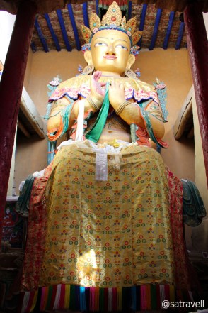 The 13.7m high gold-coloured statue of Maitreya Buddha inside the Gompa