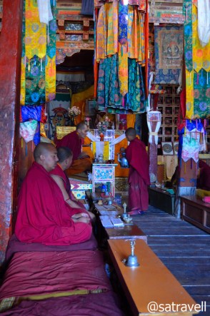 Occupied with their routine religious chores, the lams inside the Du-khang