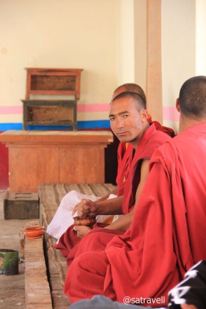 Young monks cleaning butter lamps