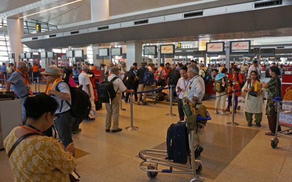 The Yatris preparing for a group check-in at the New Delhi airport