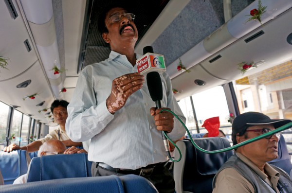 A TV press reporter inside our bus