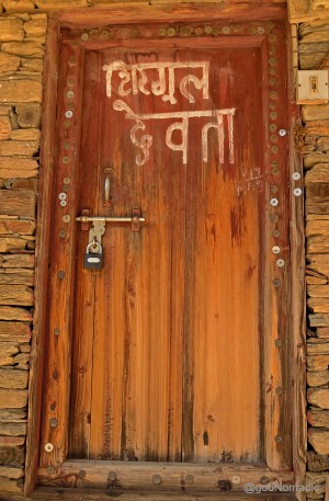The doorway had numerous coins nailed on its frame; said to be signifying the answered prayers.