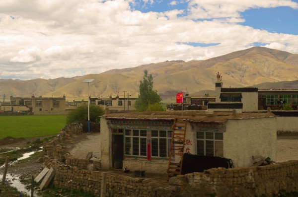 A typical house in a village; notice the Flag of China, more seemed like an act of compulsion