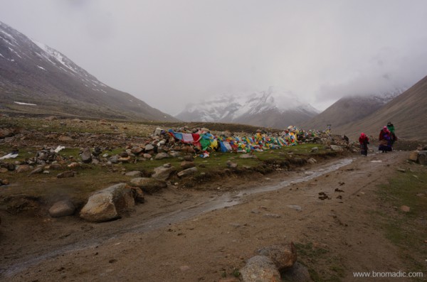 Just before Deraphuk; prayer flags festooned around rocks indicate a sacred shrine on the Kora