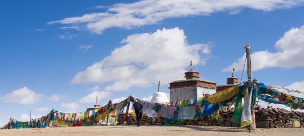 Darchen - Chiu Monastery - Manasarovar Lake - Tibetan Plateau - Tibet Autonomous Region - China With jeep on the road. Chiu Gompa Monastery or Ji'wu temple in Western Tibet: It is located a short distance from the small town of Darchen at the base of Mt. Kailash. It is about a 900 km drive from Lhasa and usually takes about four days. Western Tibet is remote, rugged, windy, and cold. It is much more rural than Central and Eastern Tibet. The people of this rugged area dress in long thick robes to protect themselves from the constant wind and cold. The woman all wear the distinctive fuchsia scarves around their heads. http://intothemiddlekingdom.com/2012/09/16/chiu-gompa-monastery-in-western-tibet/ We pass: Lake Manasarovar is a freshwater lake in the Tibet 940 kilometres from Lhasa. To the west of it is Lake Rakshastal; to the north is Mount Kailash. https://en.wikipedia.org/wiki/Lake_Manasarovar The Tibetan Plateau, is a vast elevated plateau in Central Asia or East Asia, covering most of the Tibet Autonomous Region and Qinghai Province in western China, as well as part of Ladakh in Jammu and Kashmir state of India. It stretches approximately 1,000 kilometres north to south and 2,500 kilometres east to west. With an average elevation exceeding 4,500 metres , the Tibetan Plateau is sometimes called "the Roof of the World" and is the world's highest and largest plateau, with an area of 2,500,000 square kilometres (about five times the size of Metropolitan France). Sometimes termed the "Third Pole", the Tibetan Plateau is the headwaters of the drainage basins of most of the streams in surrounding regions. Its tens of thousands of glaciers and other geographical and ecological features serve as a "water tower" storing water and maintaining flow. The impact of global warming on the Tibetan Plateau is of intense scientific interest. https://en.wikipedia.org/wiki/Tibetan_Plateau