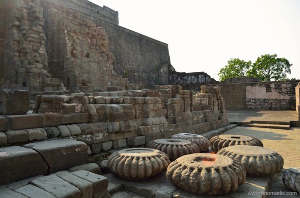 Within the courtyard a number of amalakas along with other broken remains were strewn around on the ground.