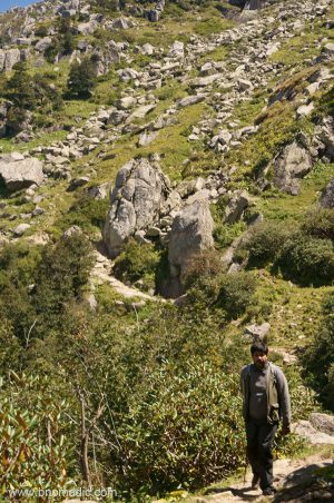 Climbing down through boulders and granite rocks